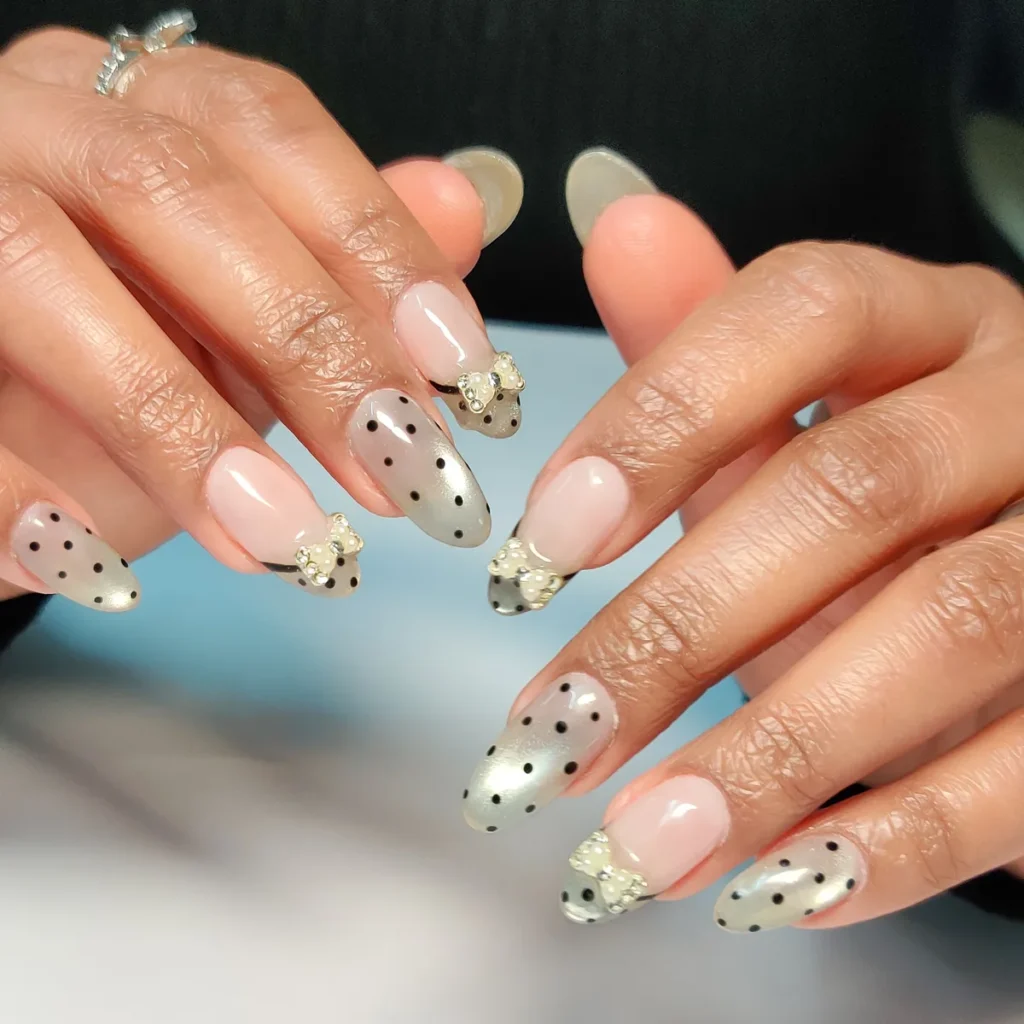 Nude bridal nail extensions with delicate floral nail art by Creative Nails Mumbai